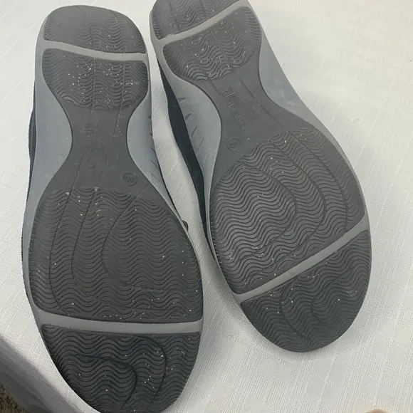 Dansko Helen sneakers in black with white trim