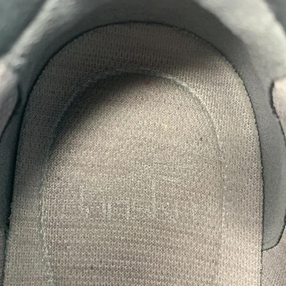 Dansko Helen sneakers in black with white trim