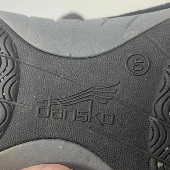Dansko Helen sneakers in black with white trim