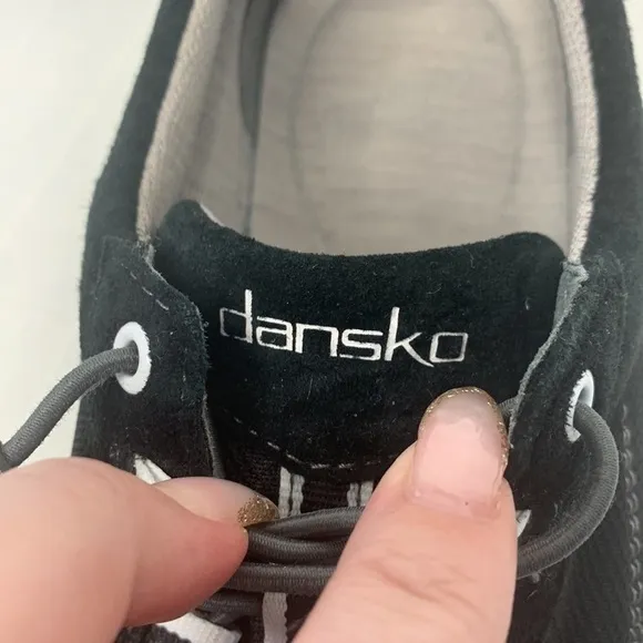 Dansko Helen sneakers in black with white trim