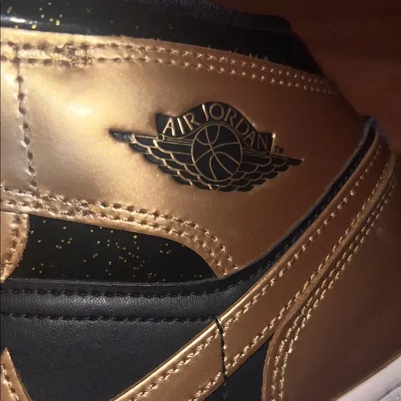 Jordan Black and Gold Sneakers with Classic Design