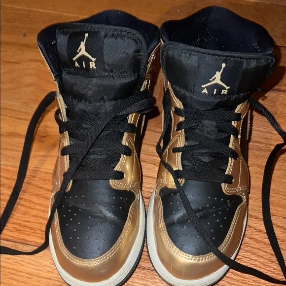 Jordan Black and Gold Sneakers with Classic Design
