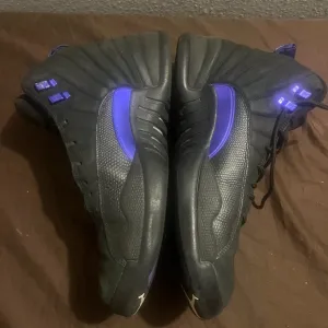 Jordan Black and Purple High-Top Sneakers with Sleek Design