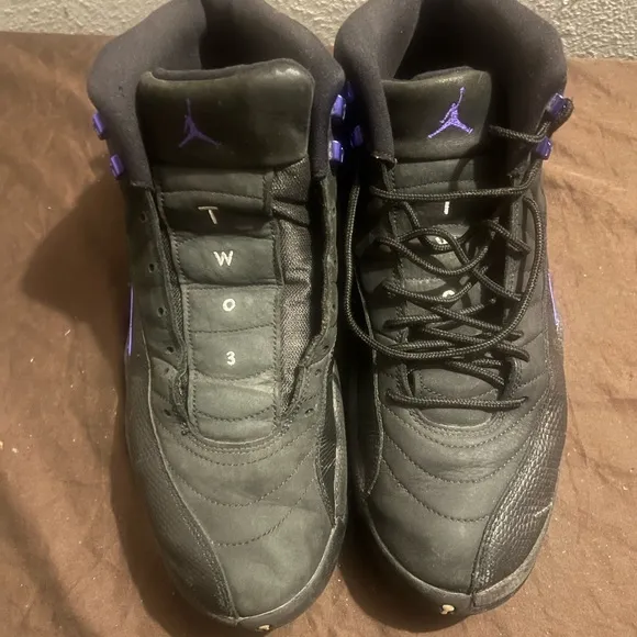 Jordan Black and Purple High-Top Sneakers with Sleek Design