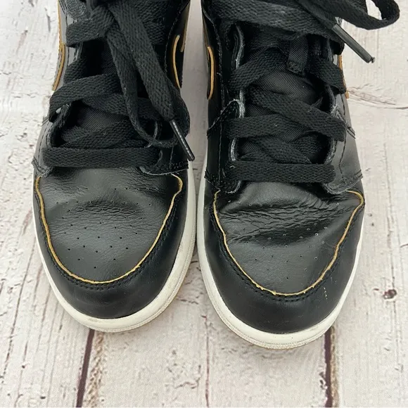 Nike Air Jordan 1 Kid’s Retro Black and Gold Basketball Shoes, Size 1.5Y