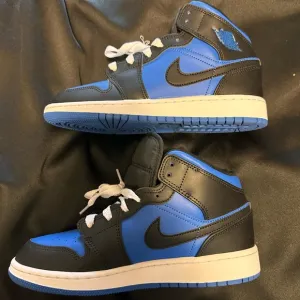 Nike Air Jordan 1 Mid Royal Blue and Black Sneakers