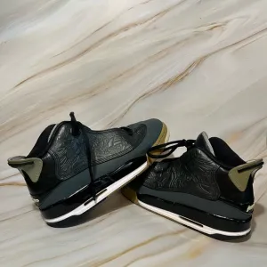 Nike Air Jordan Dub Zero Black and Gray High-Top Sneakers with Embossed Upper