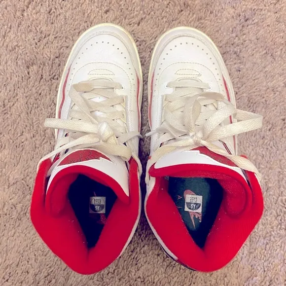 Nike Air Jordan White and Red High-Top Sneakers with Classic Basketball Design