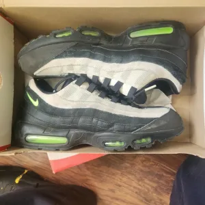 Nike Black and Green Sneakers with Air Max Cushioning