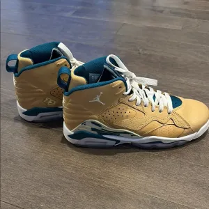 Nike Gold and Blue Sneakers with High-Top Design