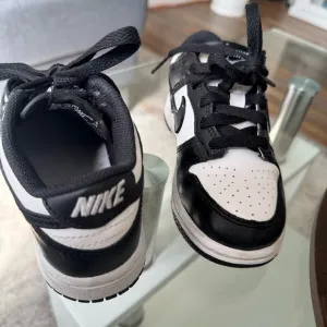 Nike Kids Black and White Sneakers, used but in good condition no box.