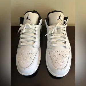 Not New (Worn Once) Jordan 1 White and Black low top